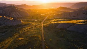 Aerial drone photograph highlighting a stunning golden hour landscape with vibrant colors, showcasing the beauty and unique perspective of drone photography.